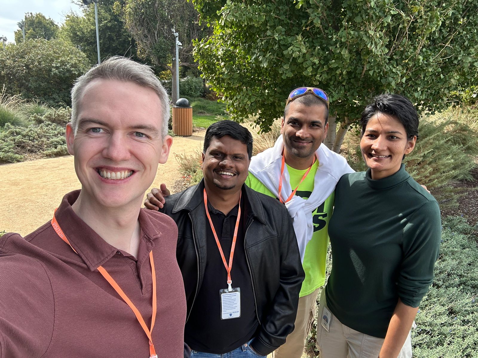 Dulan Dias with friends on the Meta campus in Menlo Park, wearing visitor badges